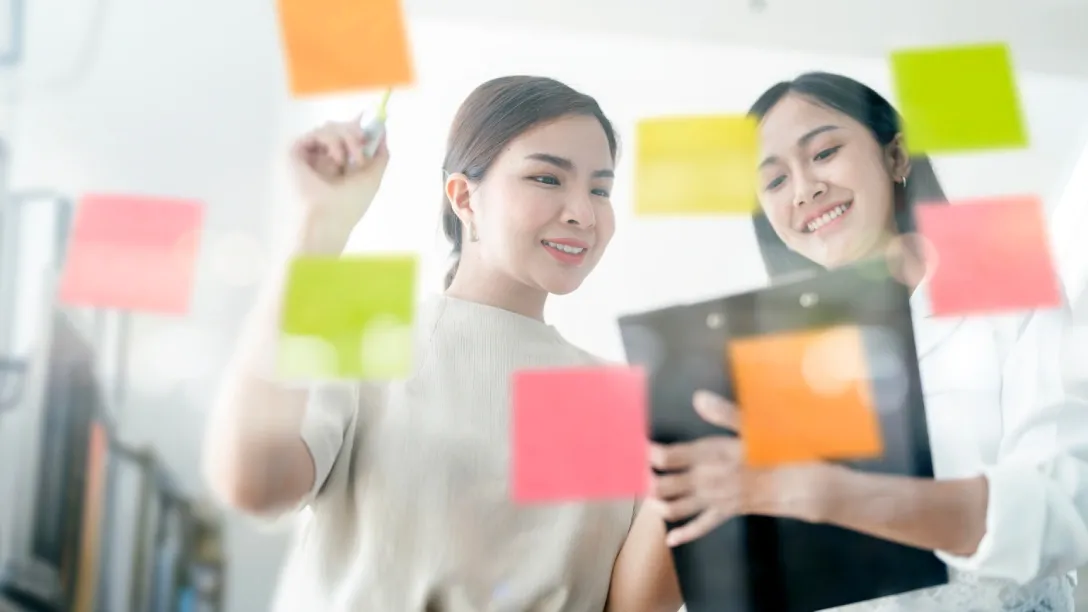 Background image InsightX marketing team analyzing and planning ad strategies to maximize returns.