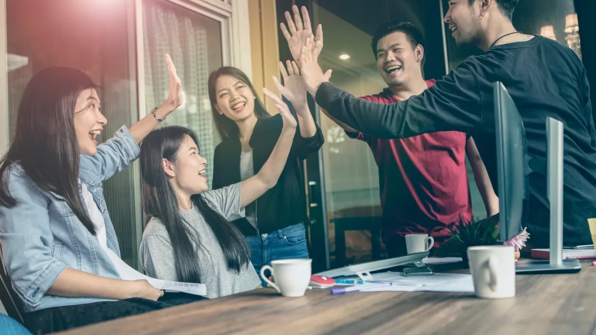 Background image of InsightX marketing team brainstorming SEO strategy